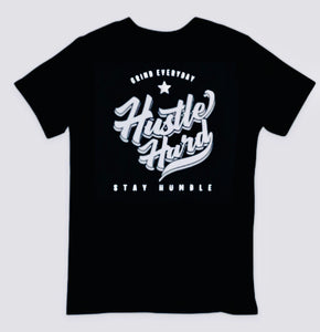 A reminder to hustle daily. Hustle hard and stay humble black and white t-shirt. “Persistently strive, remain modest” - a black and white tee as a daily nudge to keep pushing forward.